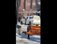 Woman black dress poses on snowy street Part 2