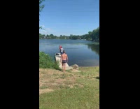 Guy jumps in water in see through underwear 