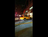Gray car gets hit on the side by taxi cab, crash onto the sidewalk