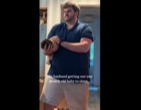 Dad getting newborn baby to sleep 