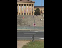 Man shadowbox practice near the museum stairs