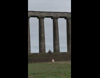 Guy play violin sit stairs large pillars part 2