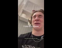 Guy pulls toilet paper and holder plays music 