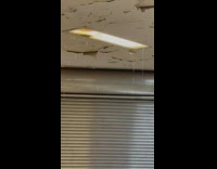 Water leaks from subway ceiling light 