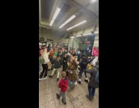 Lots of people dance in train station