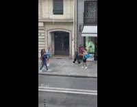 Three women walks inside the sunglasses store