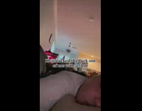 Dog plays her while asleep in the bed at day 