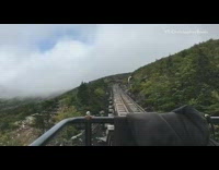 Time lapse train railroad brown mountain fog 