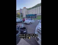 At the parking lot plays music with a large speakers 