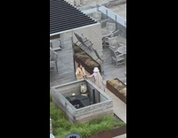 Woman gray coat full on face mask mirror photo shoot