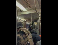 Skater boys try to balance on pole 