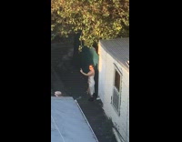 Woman twin buns slit dress alley selfie