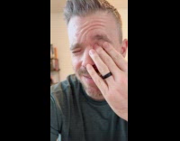 Man black shirt eye squeak when pressed