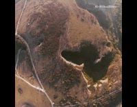 Collab risksIG - Drone camera takes video of guy walking slackline across canyon