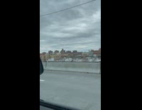 Guy does wheelie with ATV on road 