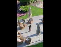 Black shirt girl selfies closed white umbrellas 