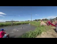 Biker flips into mud 