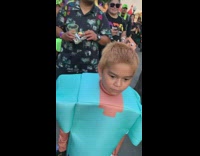 Mad hatter guy tells joke to kid wearing minecraft costume