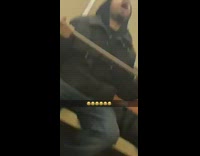 Guy sits on train cane open mouth 