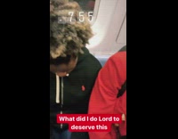 Man red jacket sings high pitched noise on subway train in the morning