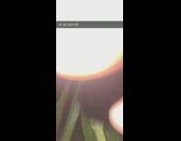 Shirtless guy looking at moon lost in grass field 