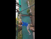 Little boy falls off green metal bar 