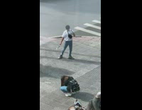 White shirt guy sidewalk motorcycles drive by