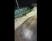 Guy does trick on roller skates at park