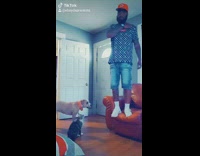 Guy does tiktok dance falls couch