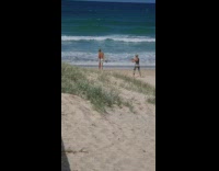 Guy run drop surfboard brown towel beach