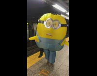 Woman rides subway on a minion costume 