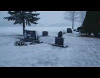 Fire near the cemetery covered in snow