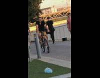 Woman black dress lip sync dub park