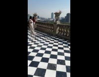 Woman places phone and poses for photo