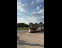 Woman goth outfit rides on lion statue