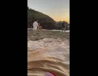 Man in Black Undershirt Dance Before Sea Sunset