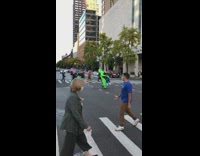 Two people wear inflatable costumes 