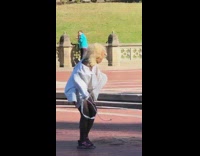 Lady man costume mask takes off straitjacket