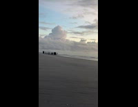Woman sees cult at beach doing ritual 