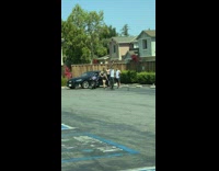 Guy white shirt teach dance group car