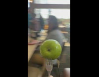College kids catching green apple with forks
