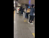 Chubby guy wearing puppy face dog shirt at station