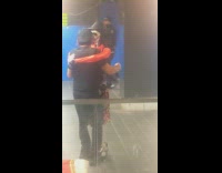 Collab Subway Creatures - Man dances with dressed skeleton subway station - glass wall view