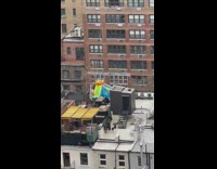 Colorful jumper on the roof a building with kids in it