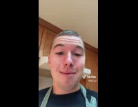 Guy in kitchen making waffles sister shoveling driveway