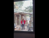 Girl red jacket dance near fire pit