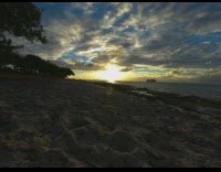 Sunset time lapse at the beach shore