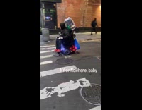 Collab WINY - Man ride electric wheelchair with speakers playing music