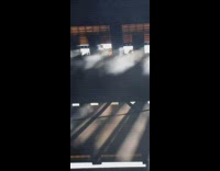 Small fire on bridge underpass white bus 