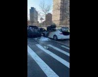 Burned car in the middle of road